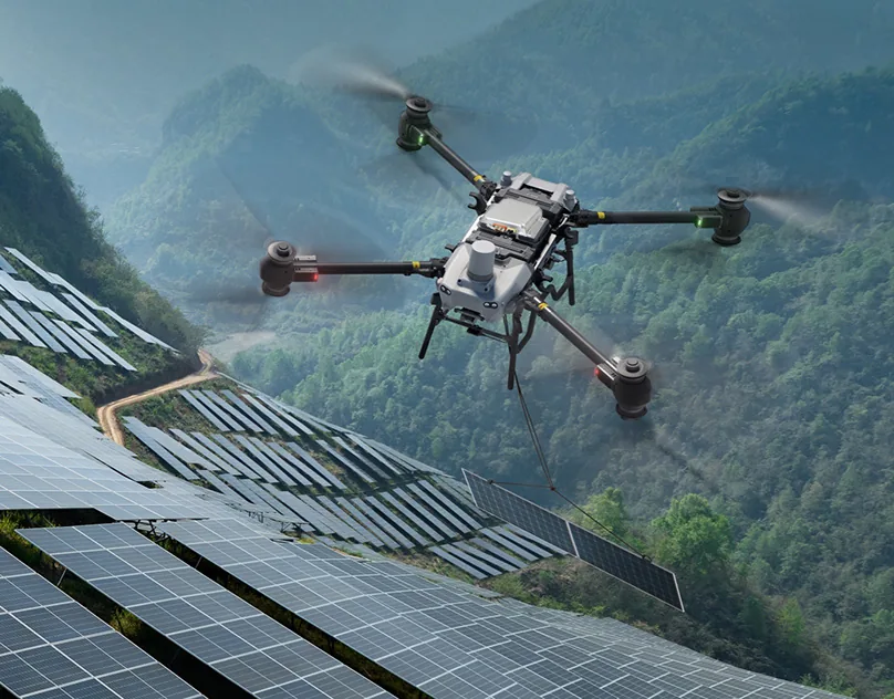 Survey drone mapping a mountainside solar farm